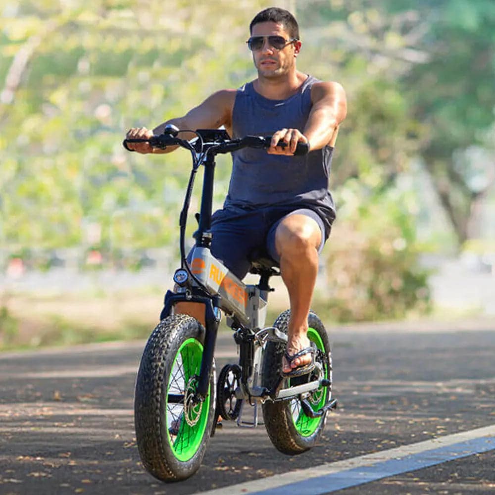 Man riding RUNDEER Hummer Folding EBike off road