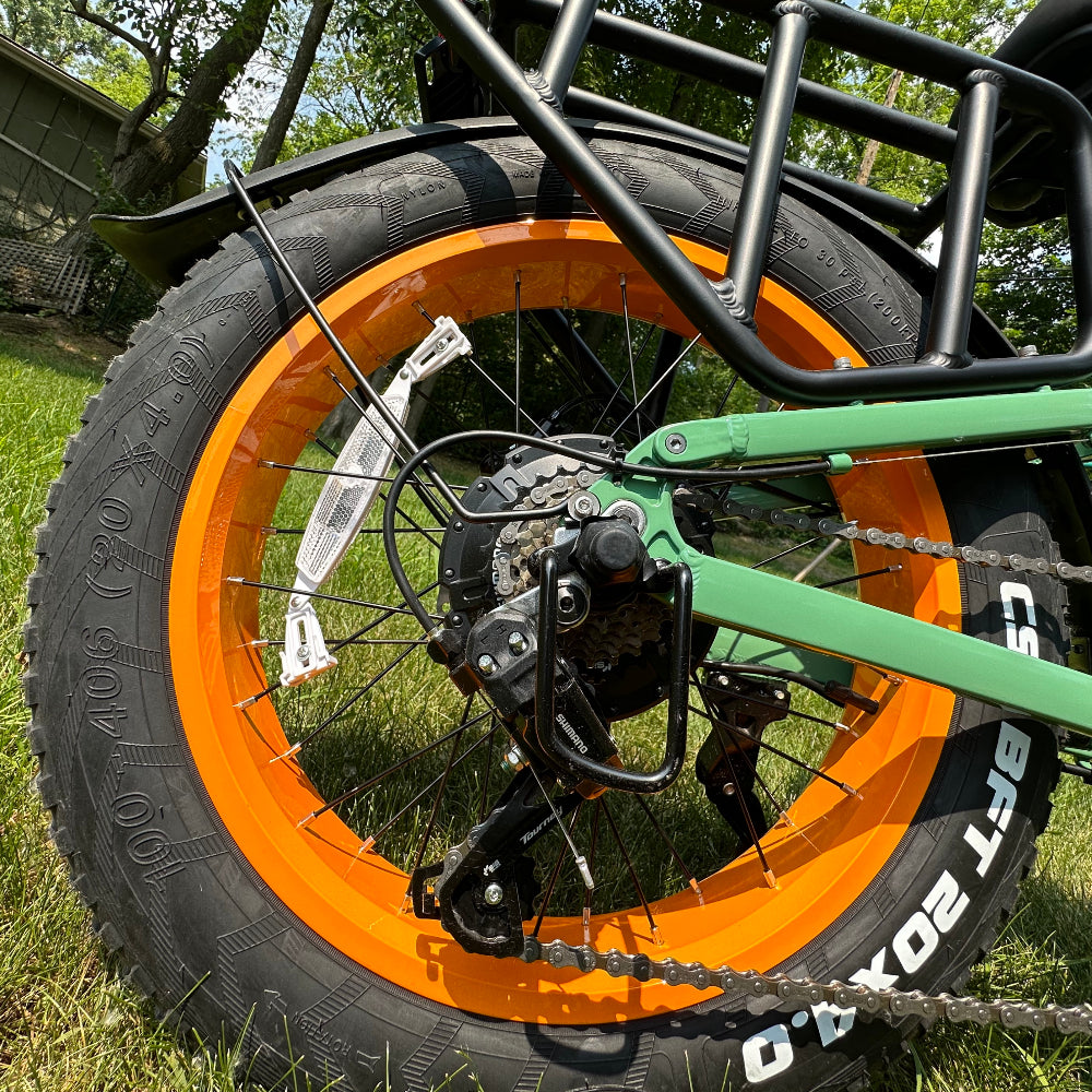 Hummer ebike rear wheel with orange rim and disc brake